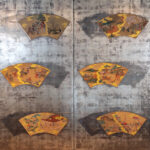 japanese antique two hold paper screen painted in ink and color on a silver ground with fans of annyal event