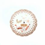 japanese antique Imari ware colored bowl with design of standing japanese dolls and butterfly